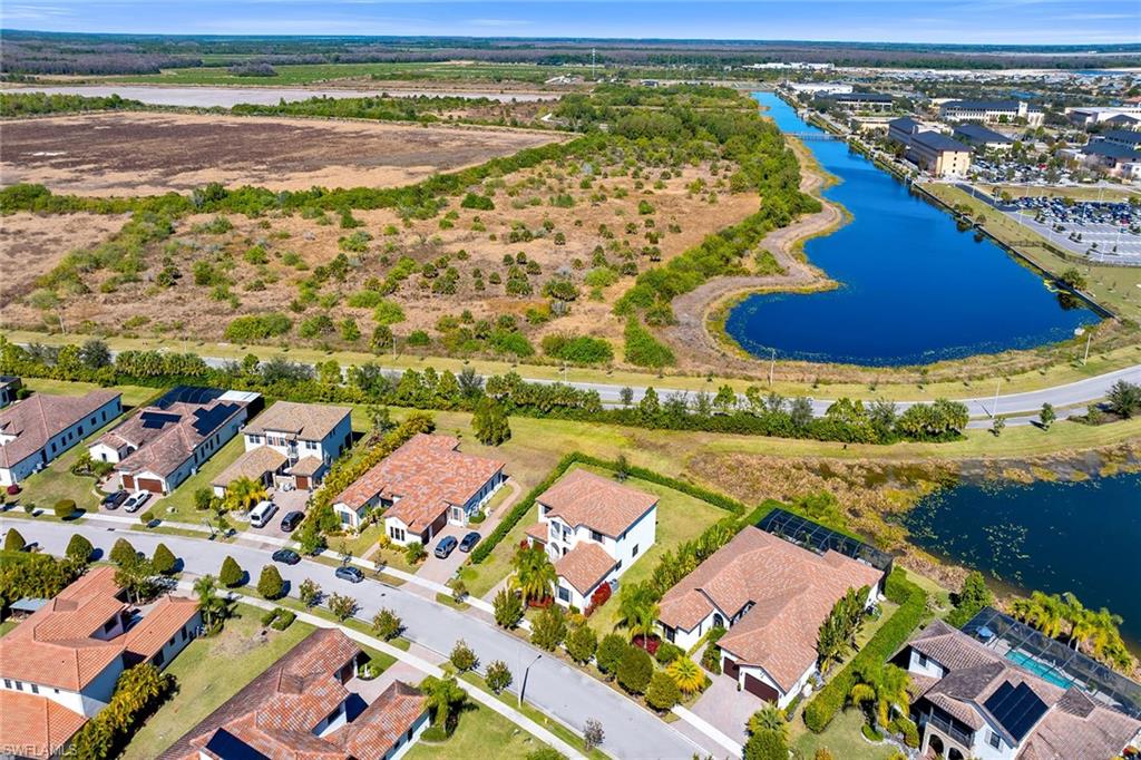5344 Chandler Way Ave Maria, FL 34142 - Photo 45 of 47 a view of an outdoor space and a lake view