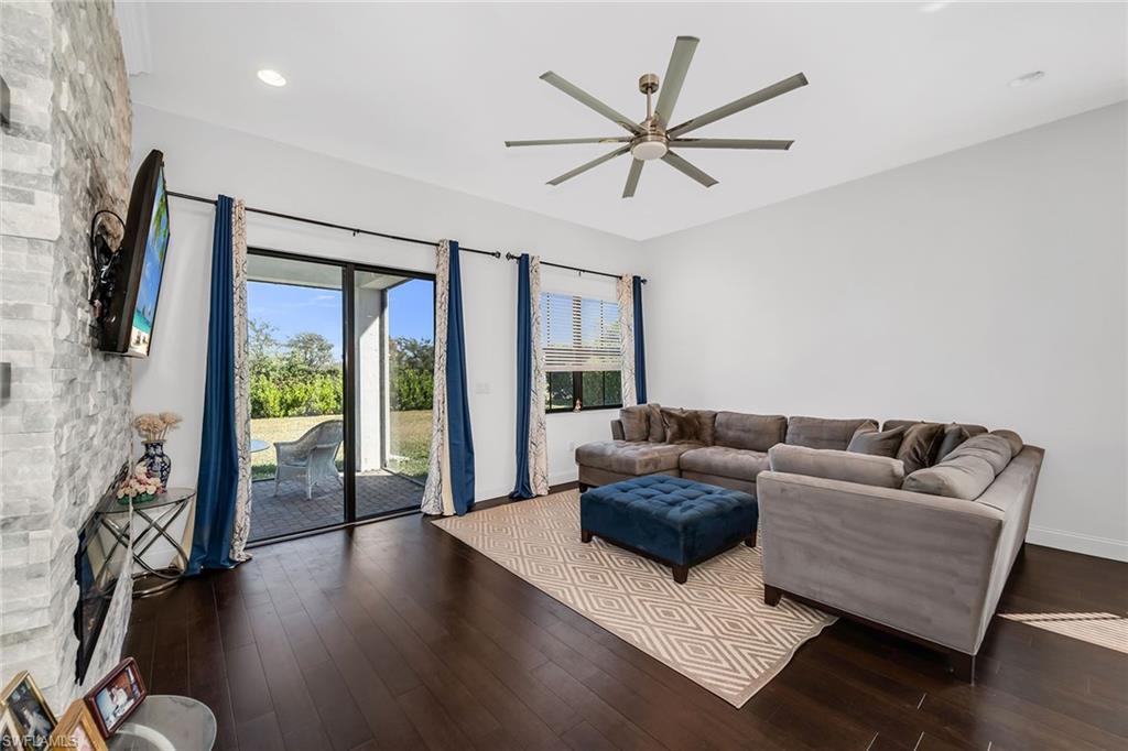 5344 Chandler Way Ave Maria, FL 34142 - Photo 5 of 47 a living room with furniture and a large window