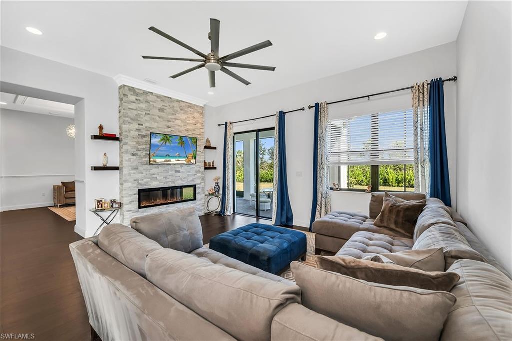 5344 Chandler Way Ave Maria, FL 34142 - Photo 6 of 47 a living room with furniture and a large window