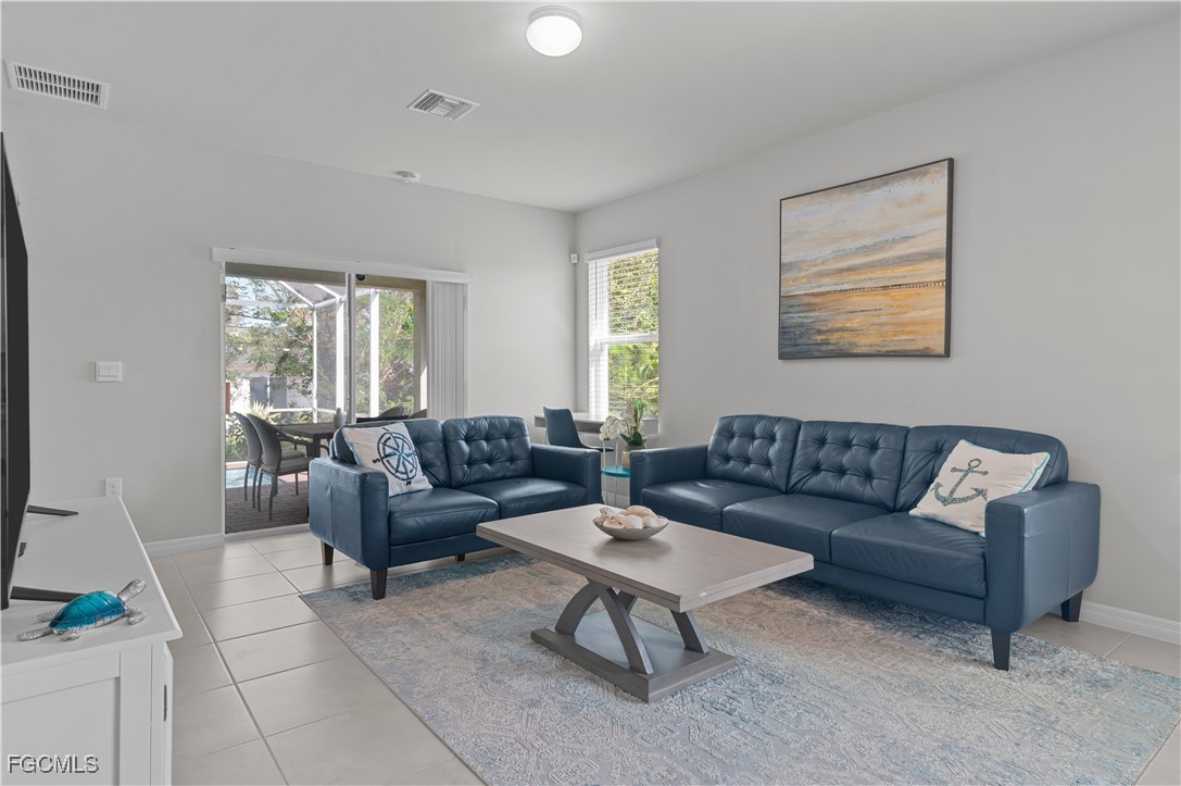 4320 Little Hickory Road Bonita Springs, FL 34134 - Photo 12 of 27 a living room with furniture and a large window