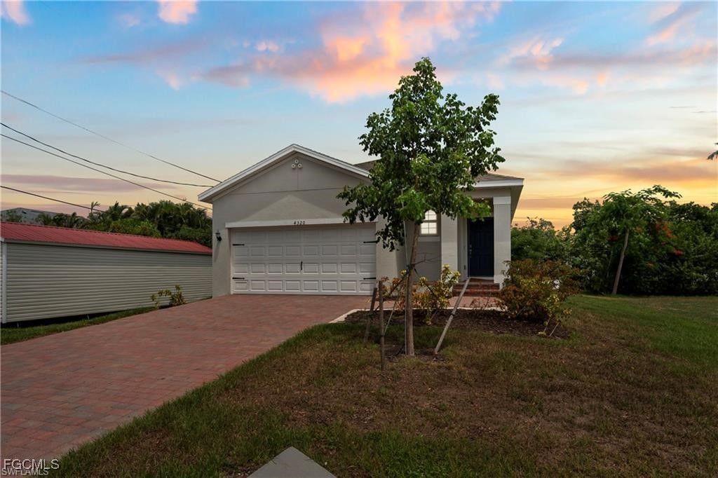 4320 Little Hickory Road Bonita Springs, FL 34134 - Photo 2 of 27 a view of backyard with table and chairs and potted plants