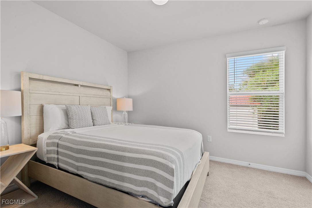4320 Little Hickory Road Bonita Springs, FL 34134 - Photo 21 of 27 a bedroom with a bed and a window