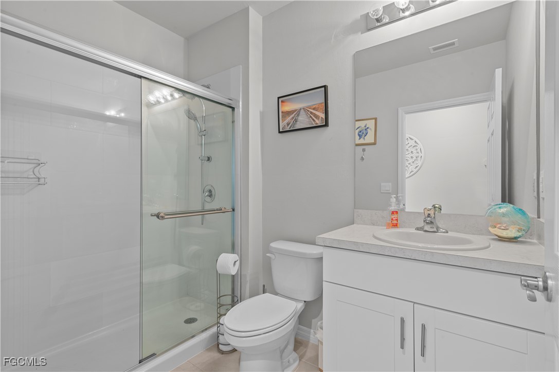 4320 Little Hickory Road Bonita Springs, FL 34134 - Photo 23 of 27 a bathroom with a sink toilet and shower