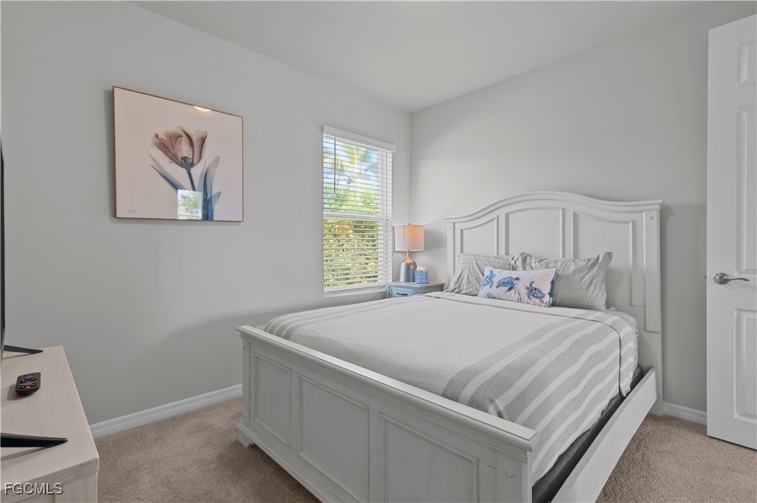 4320 Little Hickory Road Bonita Springs, FL 34134 - Photo 26 of 27 a bedroom with a bed and a window