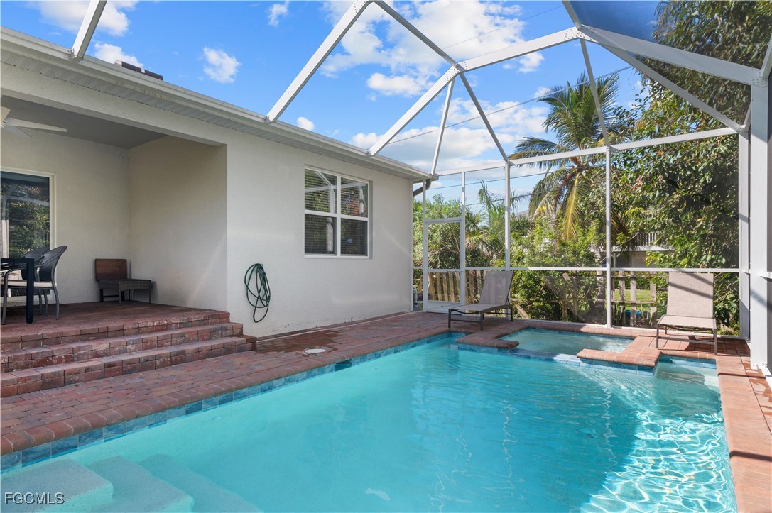4320 Little Hickory Road Bonita Springs, FL 34134 - Photo 4 of 27 a view of a backyard with chair and table