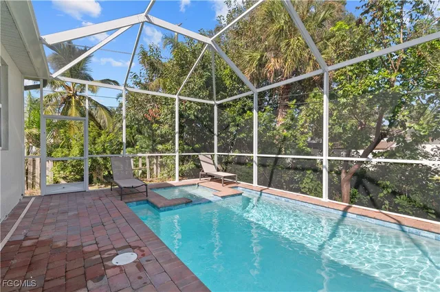 a view of roof deck with wooden floor and fence