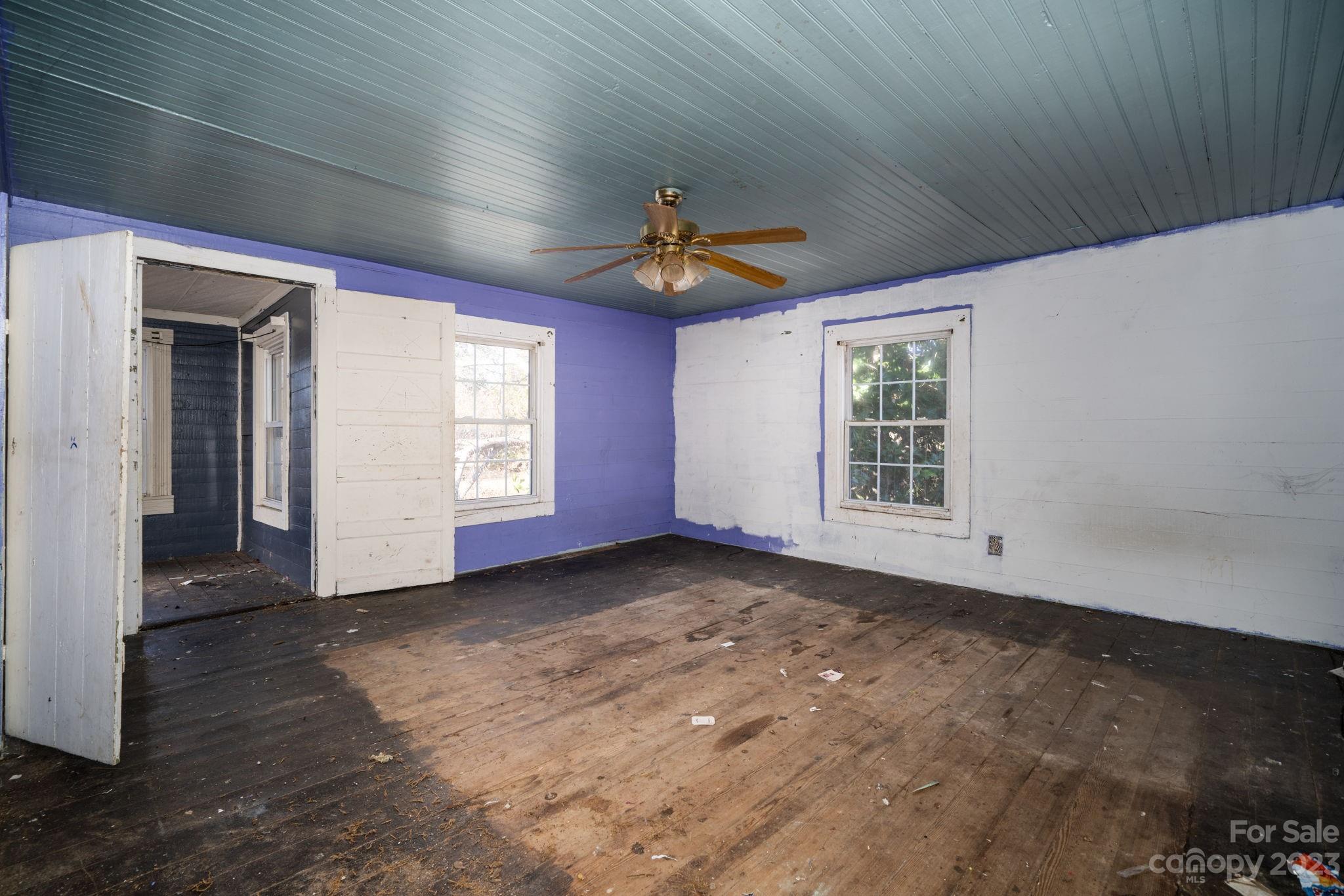 596 Old Mooresboro Road Mooresboro, NC 28114 - Photo 15 of 40 a view of a livingroom with a ceiling fan and window