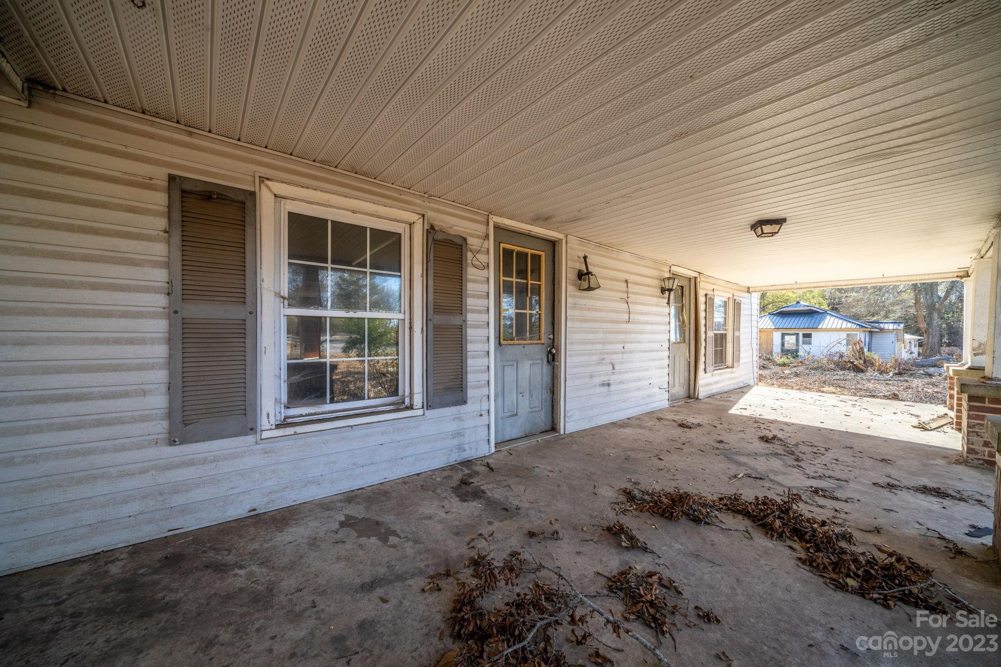 596 Old Mooresboro Road Mooresboro, NC 28114 - Photo 2 of 40 a view of a house with a backyard