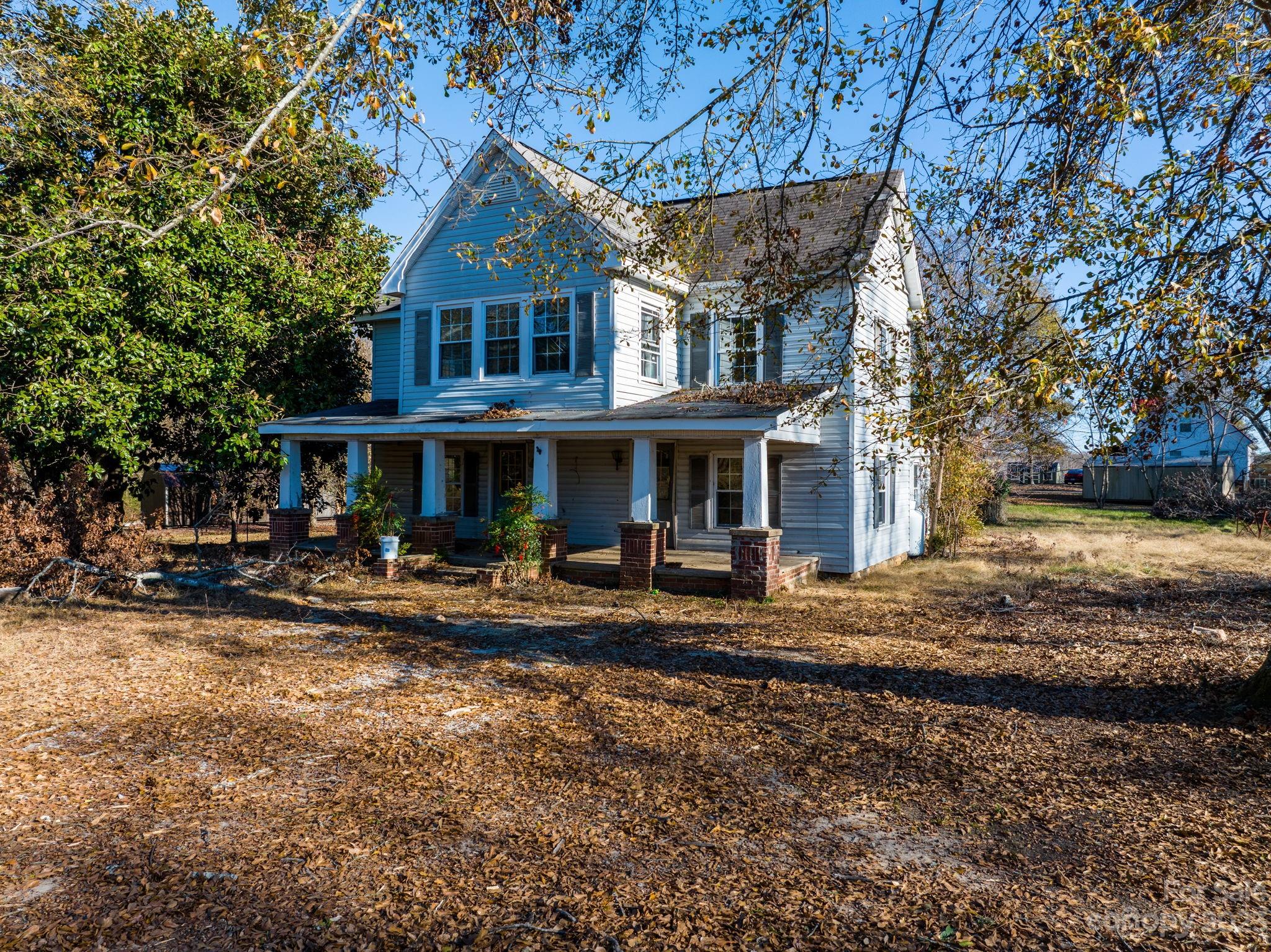 596 Old Mooresboro Road Mooresboro, NC 28114 - Photo 22 of 40 a front view of a house with yard and green space