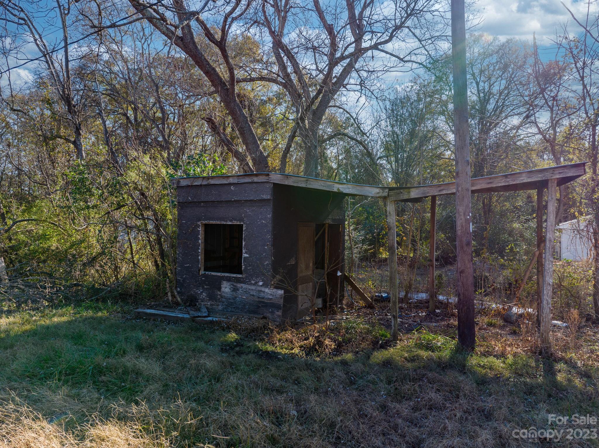 596 Old Mooresboro Road Mooresboro, NC 28114 - Photo 25 of 40 a backyard of a house with lots of green space