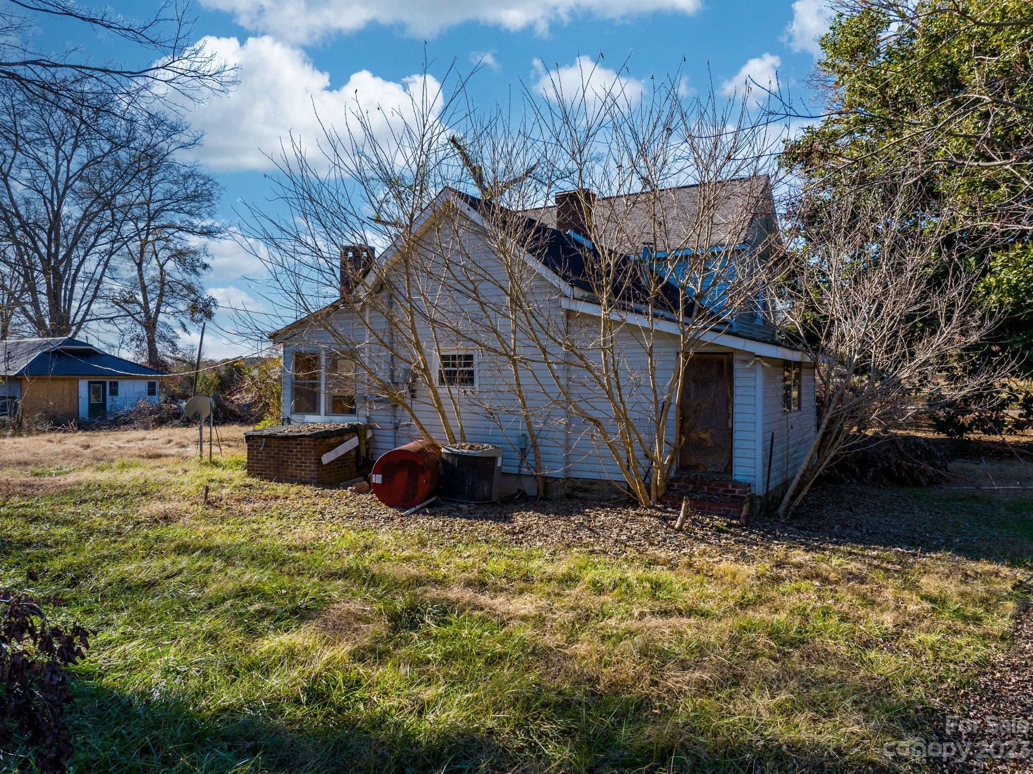 596 Old Mooresboro Road Mooresboro, NC 28114 - Photo 30 of 40 a view of a house with yard and sitting area