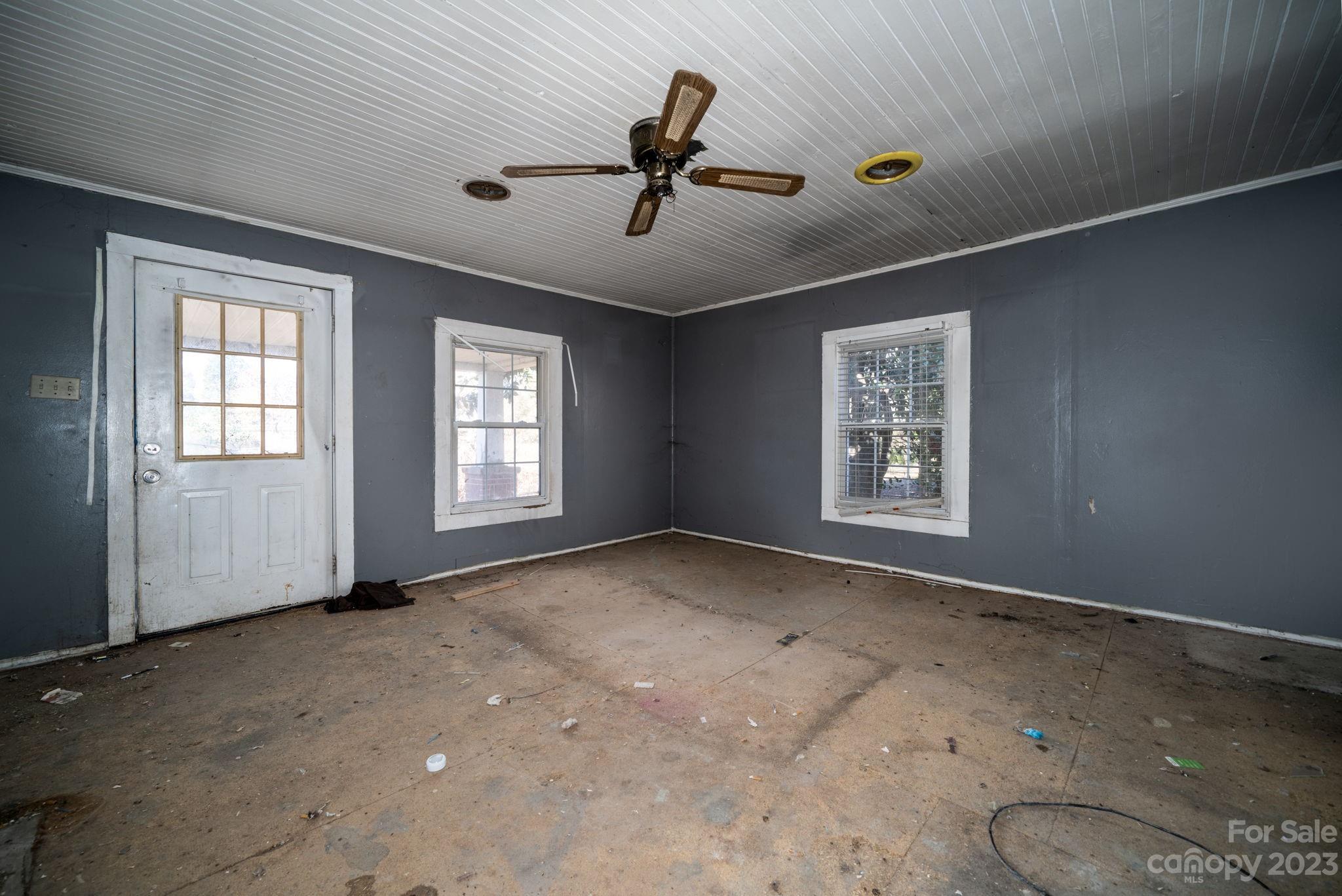 596 Old Mooresboro Road Mooresboro, NC 28114 - Photo 3 of 40 an empty room with windows