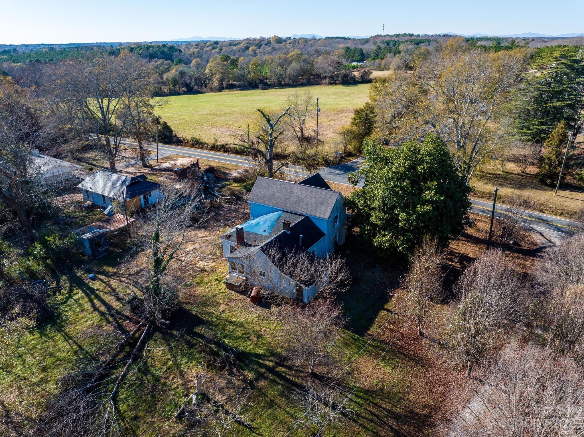 596 Old Mooresboro Road Mooresboro, NC 28114 - Photo 36 of 40 a view of a lake with a yard and mountain view