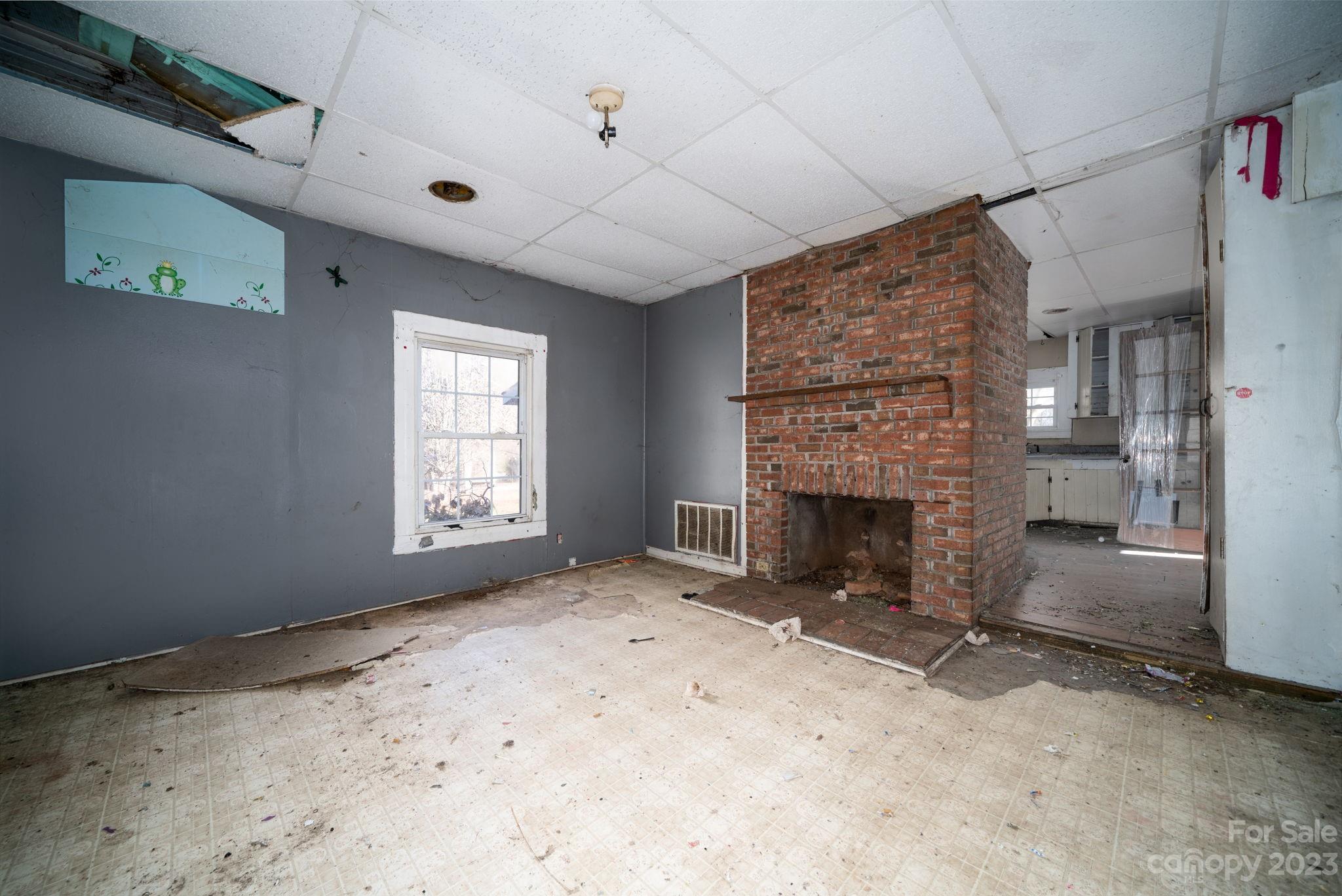 596 Old Mooresboro Road Mooresboro, NC 28114 - Photo 5 of 40 a view of empty room with a fireplace