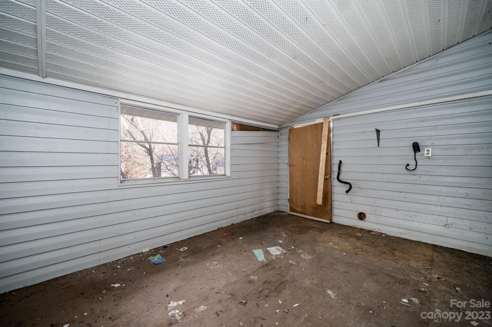 596 Old Mooresboro Road Mooresboro, NC 28114 - Photo 8 of 40 a view of an empty room with a window