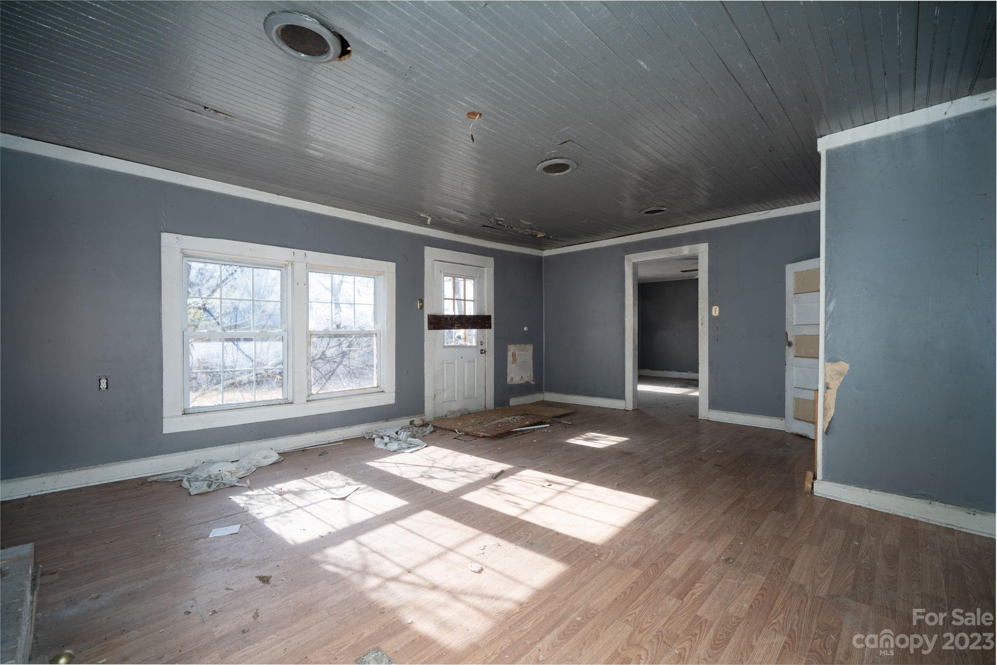 596 Old Mooresboro Road Mooresboro, NC 28114 - Photo 10 of 40 a view of an empty room with wooden floor and a window