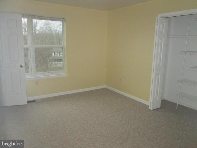 426 Rachaels Way Prince Frederick, MD 20678 - Photo 11 of 22 an empty room with a window