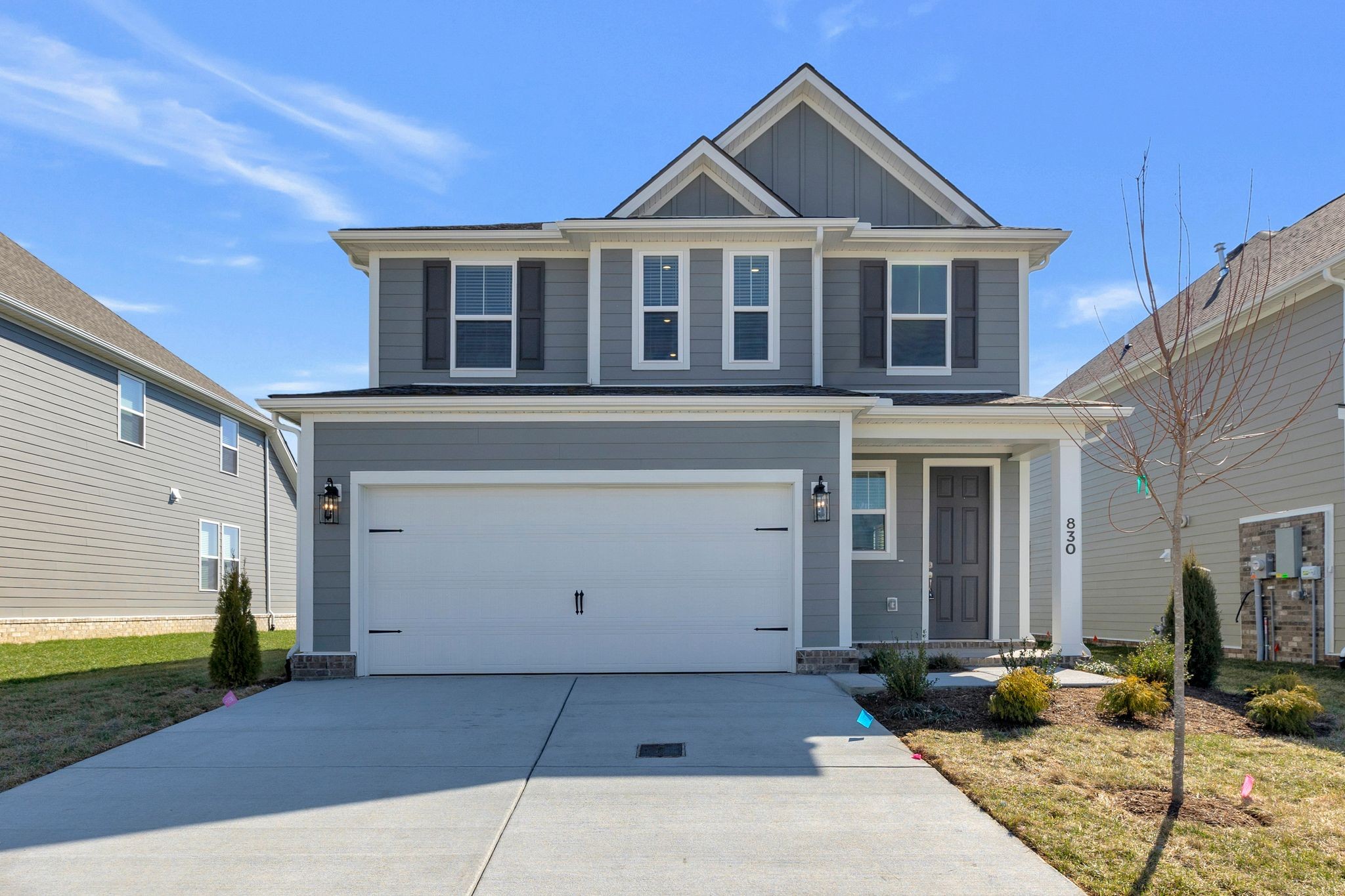 830 Sugarbush Ln Spring Hill Thompson's Station, TN 37179 - Photo 1 of 32 a front view of a house with a garden