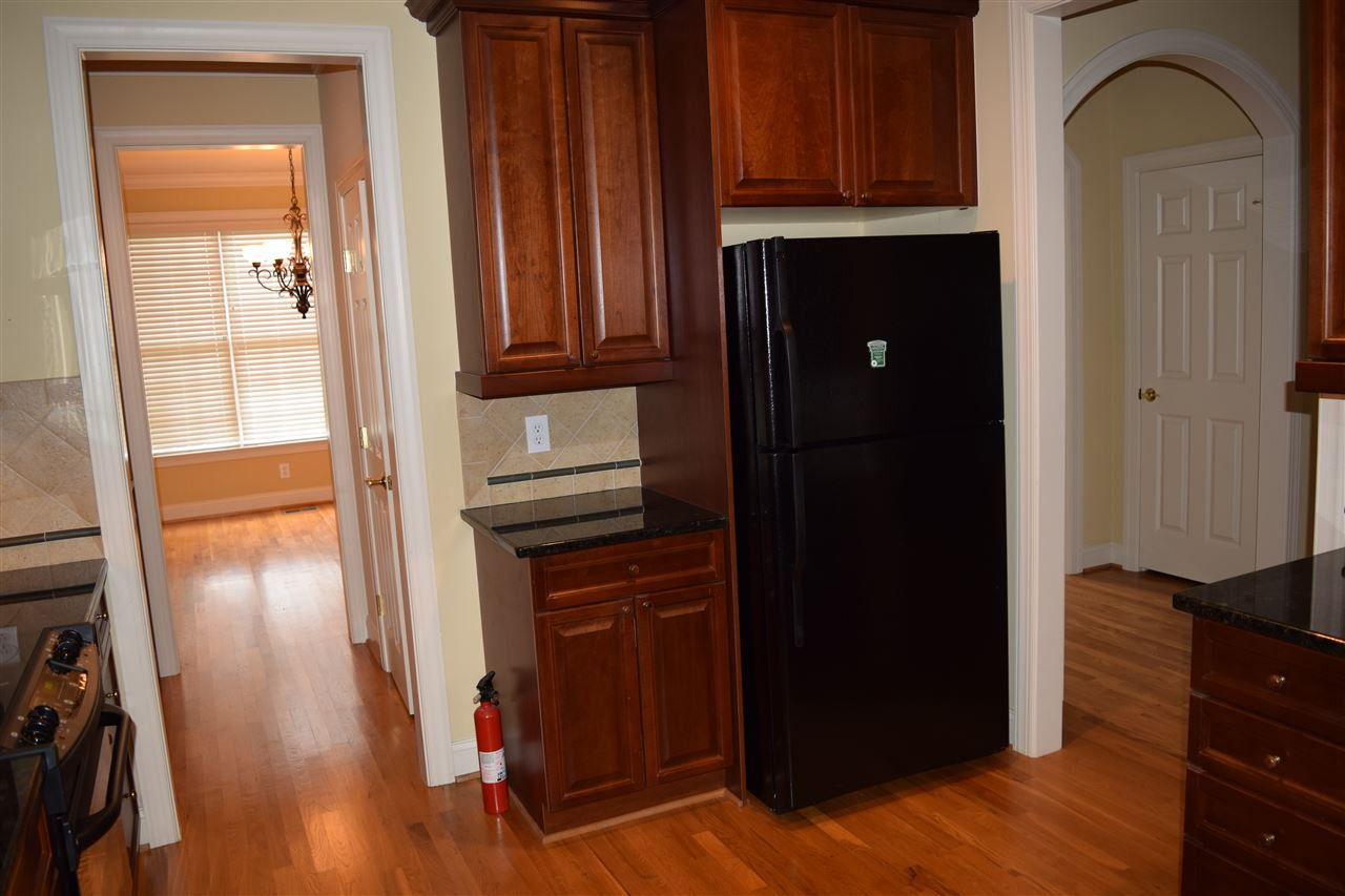 9307 Tabriz Point Raleigh, NC 27614 - Photo 10 of 24 Kitchen area showing refrigerator and storage. Another view of kitchen