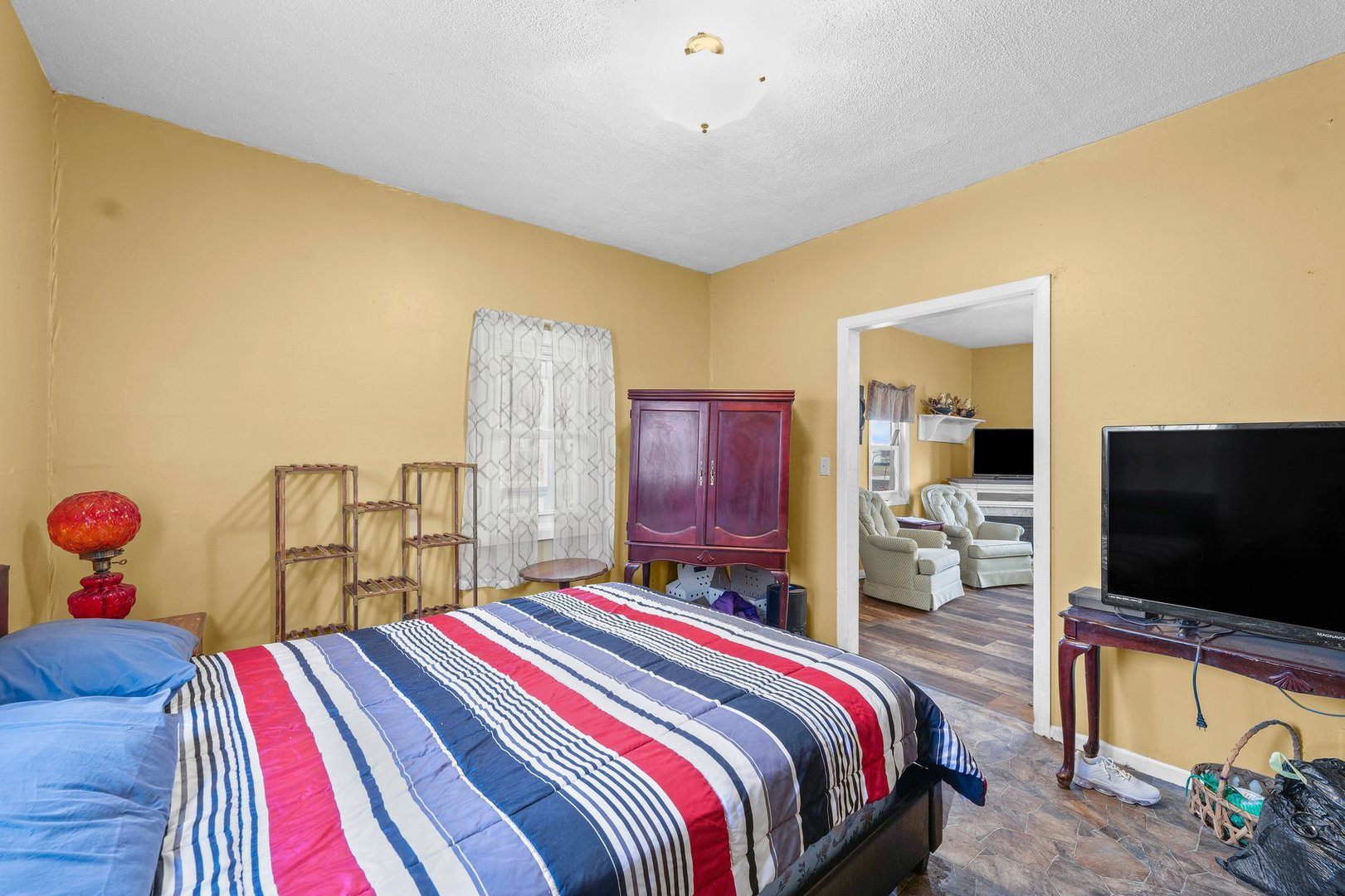 220 Western Avenue De Land, IL 61839 - Photo 16 of 24 a bedroom with a bed and a flat screen tv