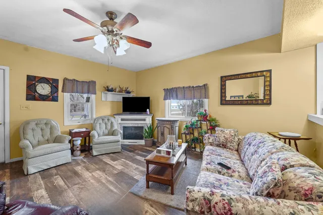 a living room with furniture and a flat screen tv