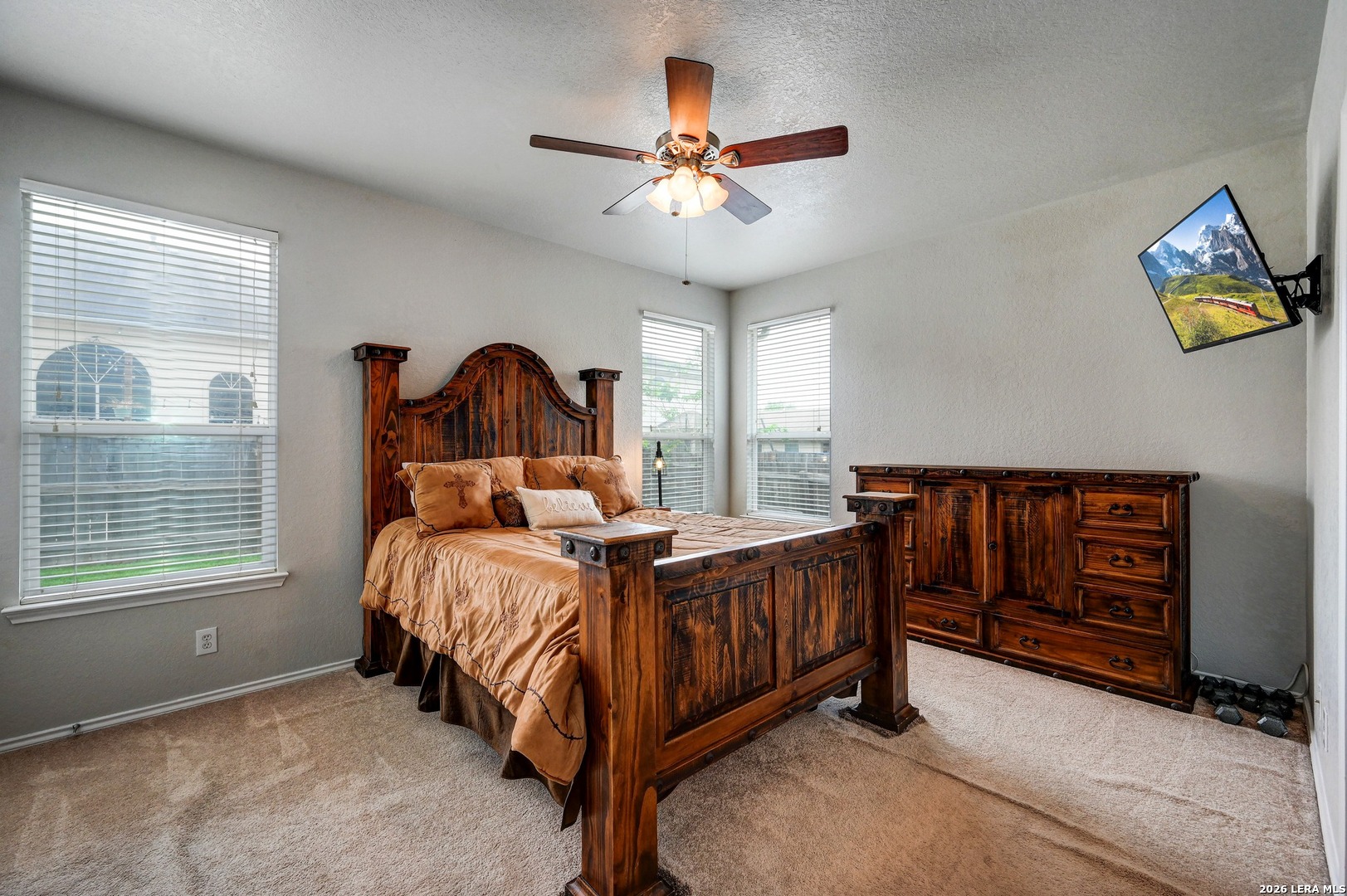 720 Hollow Ridge Schertz, TX 78108 - Photo 15 of 27 a bed sitting in a bedroom next to a window