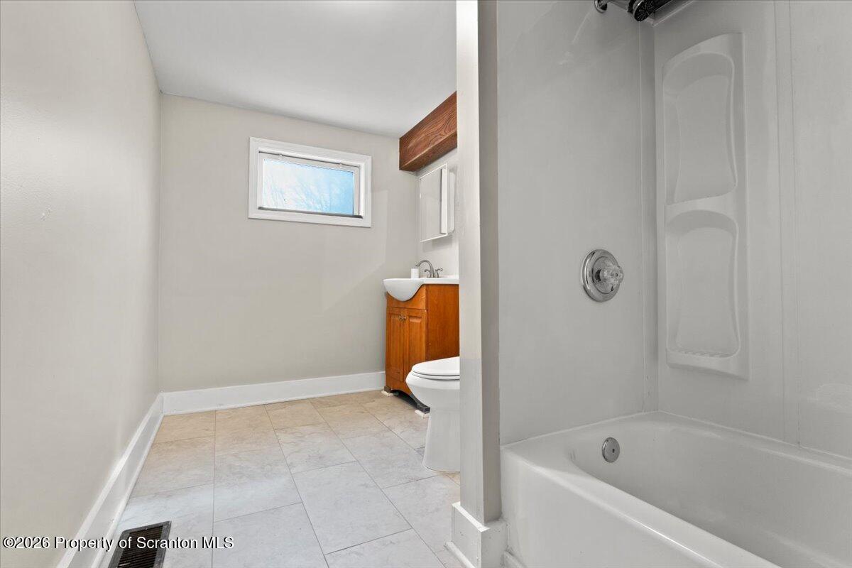 18 Linden Street Luzerne, PA 18709 - Photo 13 of 32 a bathroom with a bathtub and shower