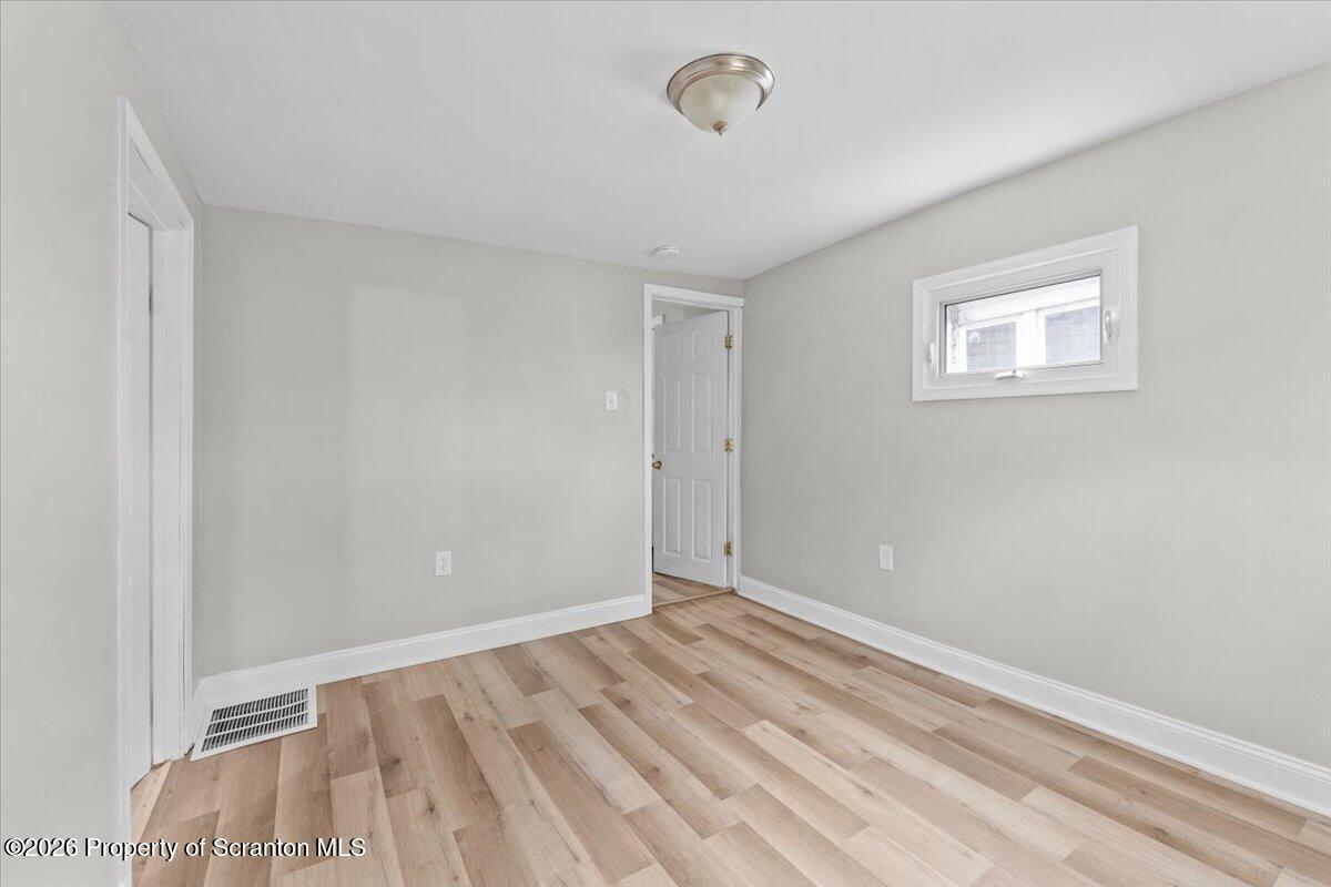 18 Linden Street Luzerne, PA 18709 - Photo 16 of 32 a view of room with wooden floor and fan