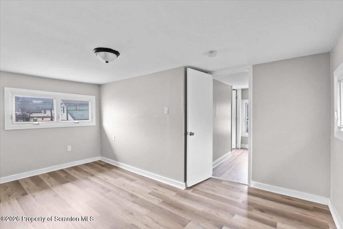 18 Linden Street Luzerne, PA 18709 - Photo 19 of 32 a view of empty room with wooden floor