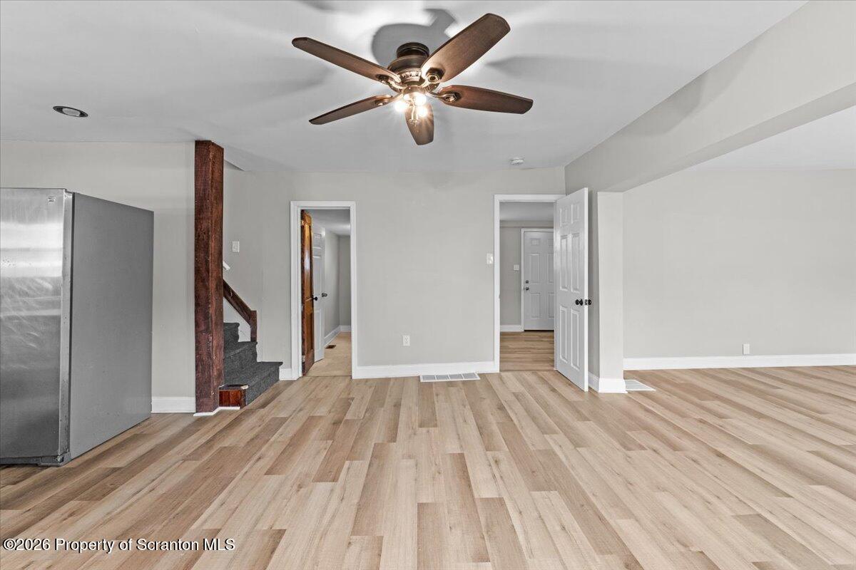 18 Linden Street Luzerne, PA 18709 - Photo 3 of 32 a view of an empty room with wooden floor and a ceiling fan