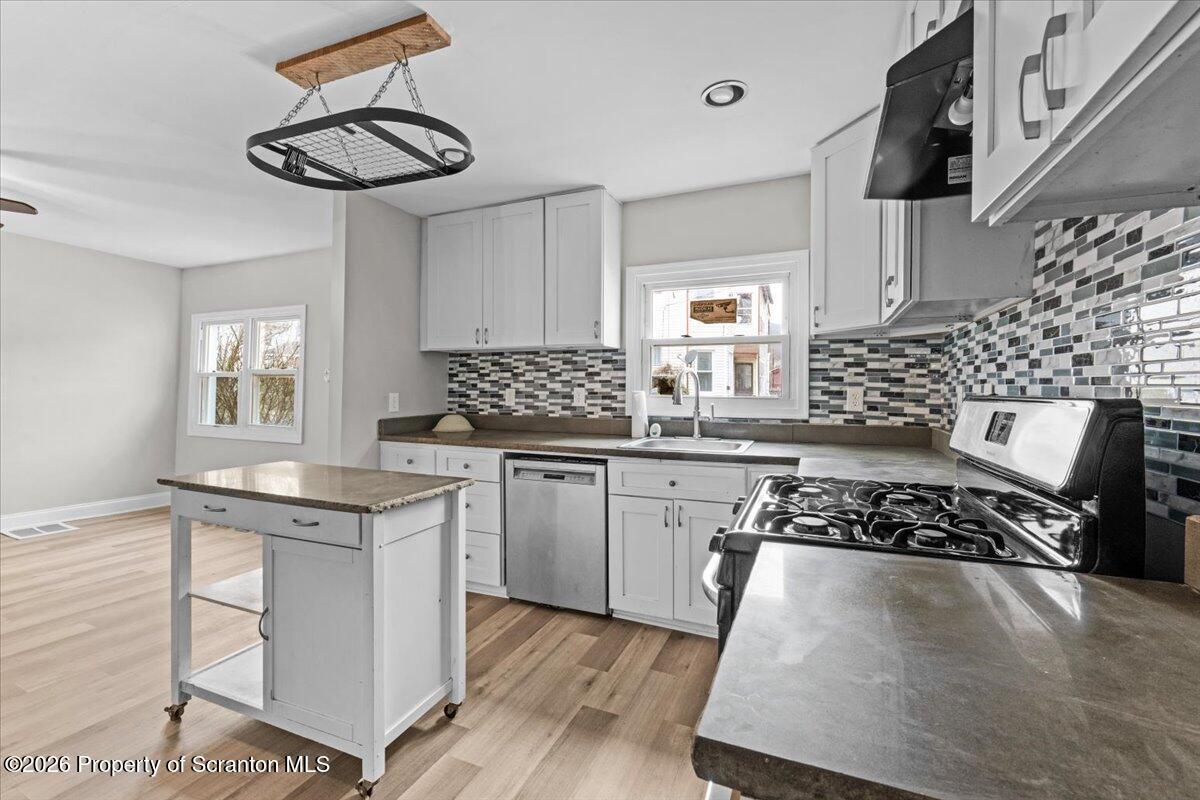 18 Linden Street Luzerne, PA 18709 - Photo 5 of 32 a kitchen with stainless steel appliances granite countertop a sink stove and cabinets