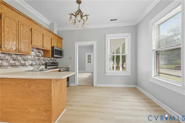 a bathroom with a toilet sink vanity and mirror