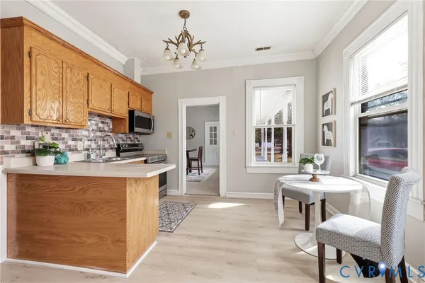 a bedroom with a bed lamp and a window
