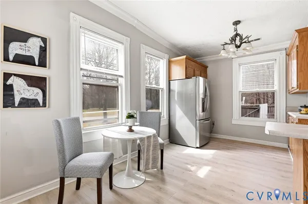 a bedroom with a bed a mirror and lamp