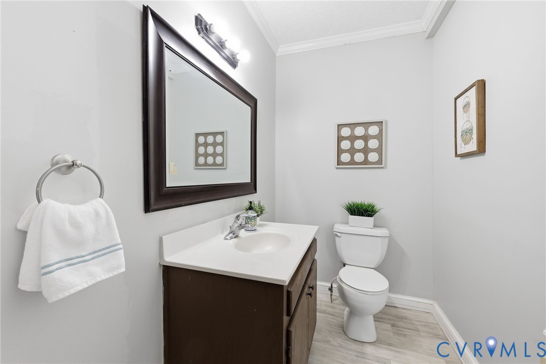 1022 South Main Street Blackstone, VA 23824 - Photo 16 of 35 a bathroom with a toilet sink and mirror