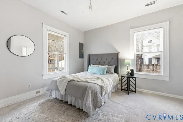 a bathroom with a bathtub sink and mirror