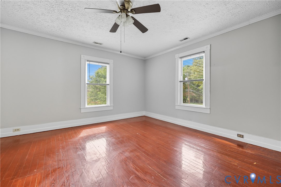 1022 South Main Street Blackstone, VA 23824 - Photo 24 of 35 a view of an empty room with wooden floor and a window