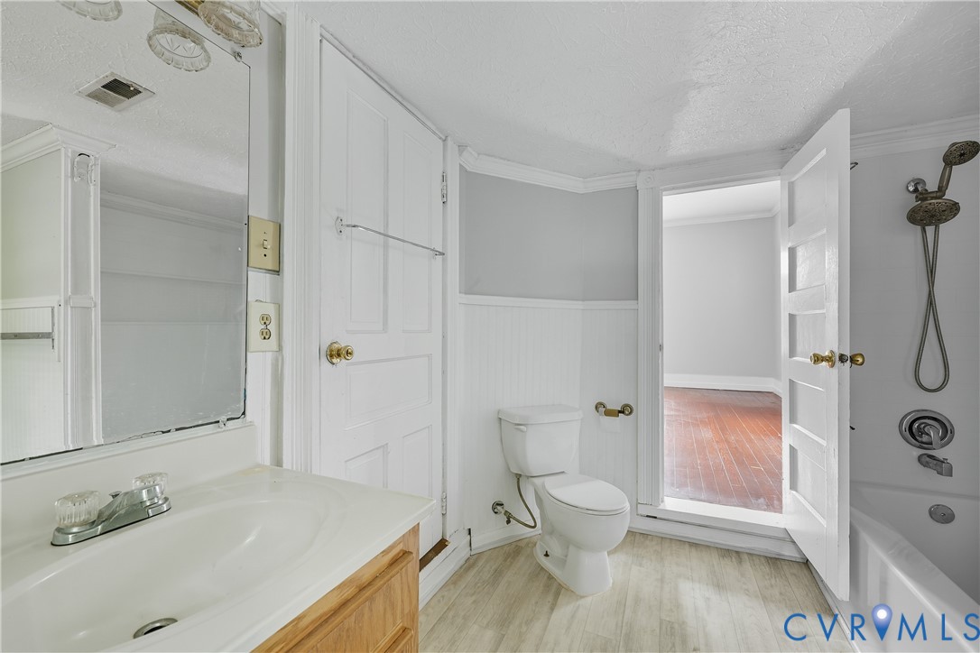1022 South Main Street Blackstone, VA 23824 - Photo 26 of 35 a bathroom with a sink a toilet and shower