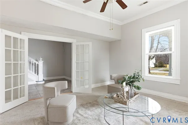 a dining room with furniture and window