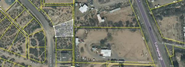 an aerial view of houses with yard
