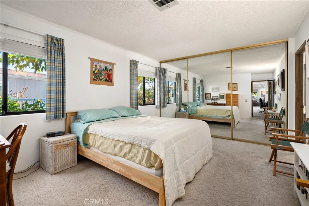 334 Bobwhite Paso Robles, CA 93446 - Photo 13 of 23 a spacious bedroom with a bed a table and chair