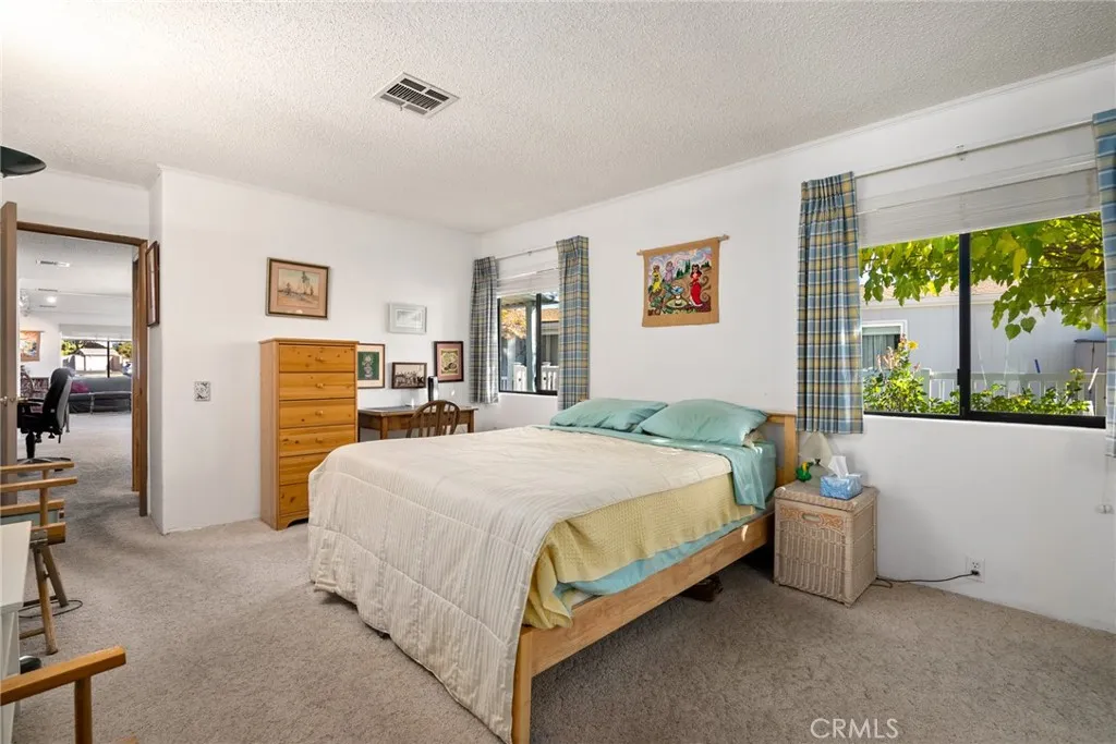 334 Bobwhite Paso Robles, CA 93446 - Photo 14 of 23 a bedroom with a bed and a large window