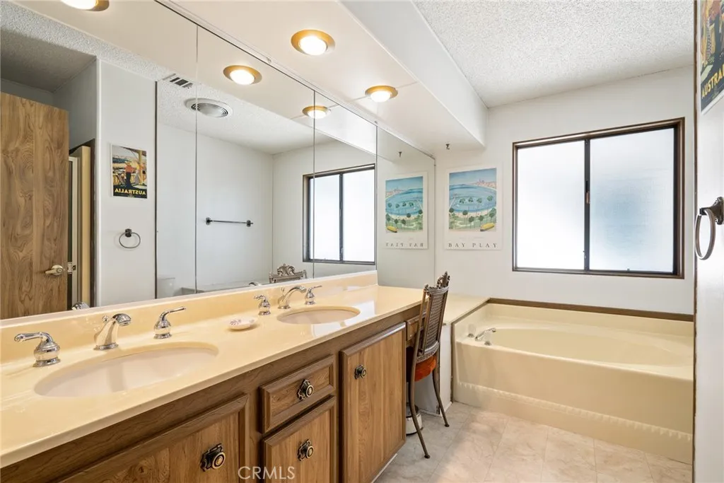 334 Bobwhite Paso Robles, CA 93446 - Photo 15 of 23 a spacious bathroom with a tub sink shower and mirror