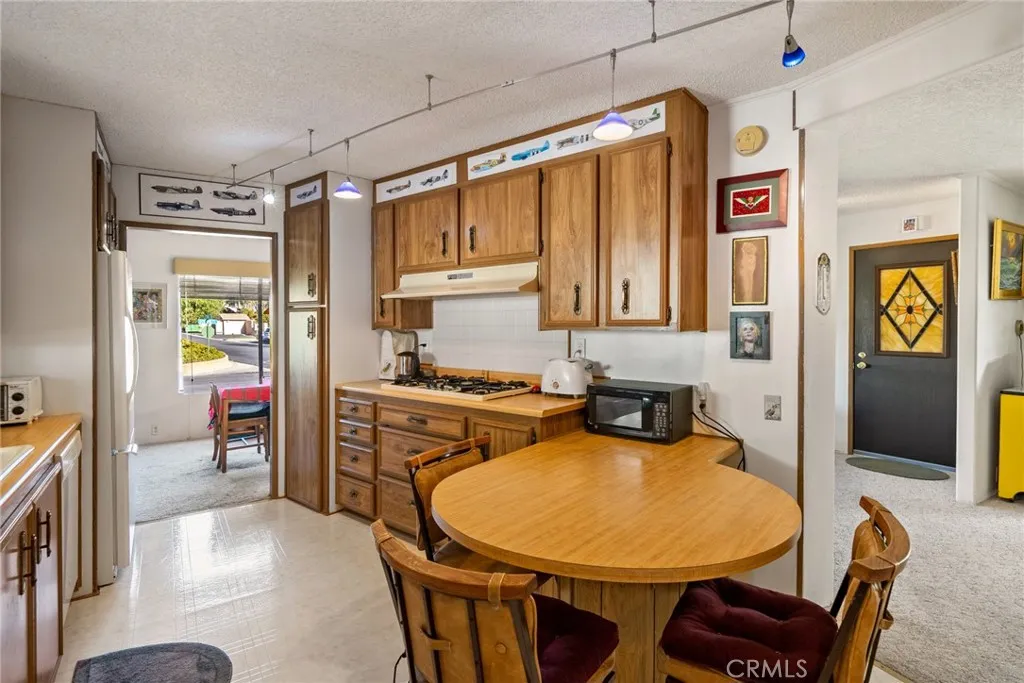 334 Bobwhite Paso Robles, CA 93446 - Photo 6 of 23 a very nice looking open kitchen with dining table and chairs