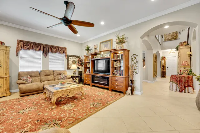 a kitchen with kitchen island granite countertop a sink a counter top space appliances and cabinets