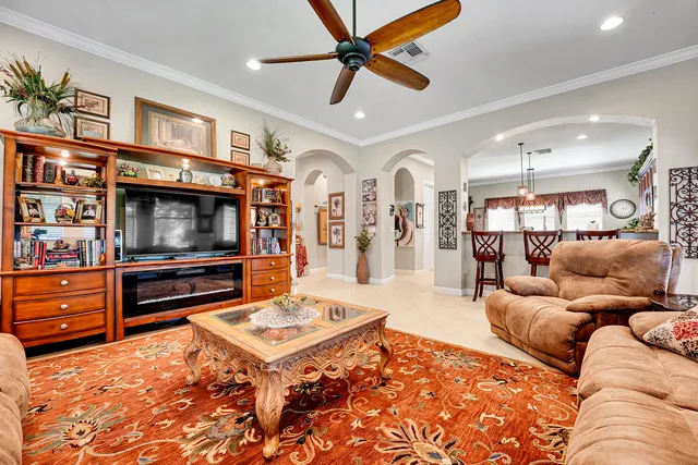 a kitchen with kitchen island granite countertop a sink stove and cabinets