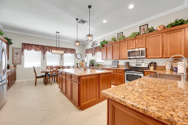 a dining table with chairs and window