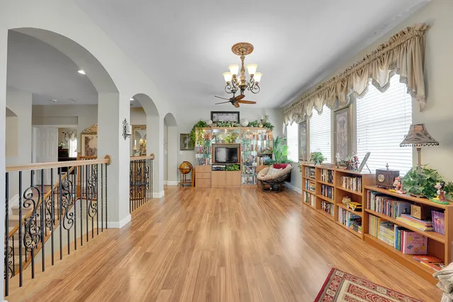 a view of a chair and table in backyard of the house