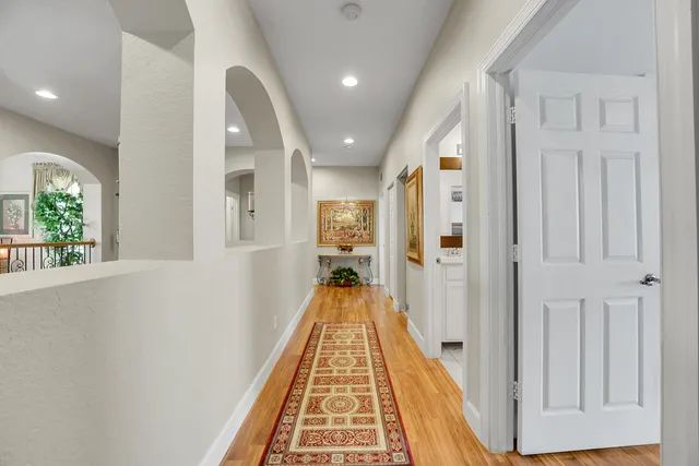 an aerial view of a house with a yard and lake view