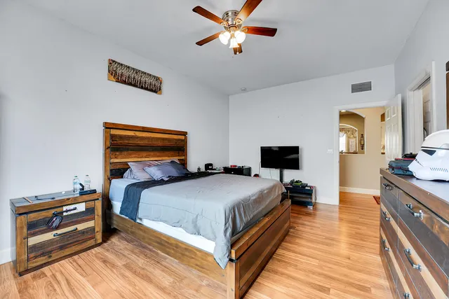an aerial view of residential houses with outdoor space and trees